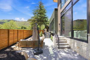 Expansive stone patio with wood privacy fencing
