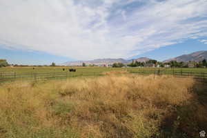 View of mountain background featuring rural landscape and a pastoral area
