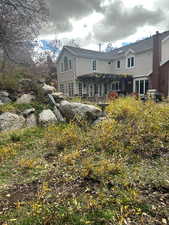 Back of house with french doors and stucco siding