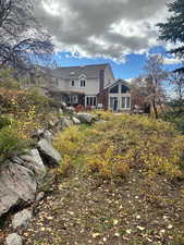 Rear view of house with french doors