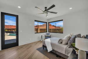 Bedroom with light wood-style flooring, access to outside, ceiling fan, and recessed lighting