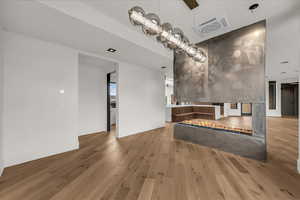 Interior space featuring cooling unit and light wood finished floors