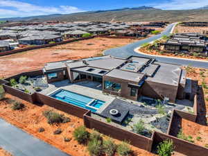 Aerial view of residential area featuring a mountainous background