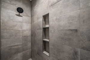 Bathroom view of a tile shower