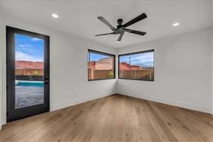 Unfurnished room with light wood-style floors, recessed lighting, and a ceiling fan