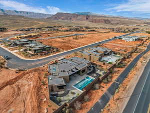 Aerial view of residential area with a mountainous background and a desert landscape