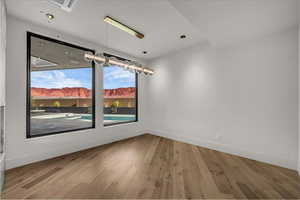 Unfurnished room featuring light wood-style flooring and cooling unit