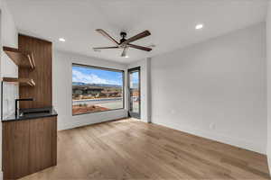 Unfurnished living room with light wood-style floors, recessed lighting, and ceiling fan