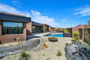 View of pool with patio surround and a fenced backyard