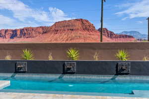 Outdoor pool featuring a mountain view