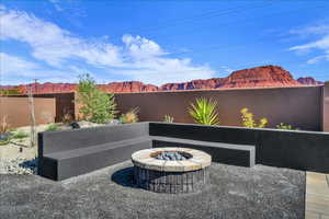 View of patio featuring a fire pit