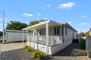 View of side of property featuring a porch
