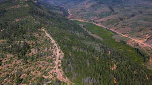 Aerial view of property's location with a mountain backdrop
