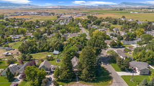 View of property location with mountains and nearby suburban area