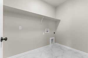 Laundry area with marble finish flooring, hookup for an electric dryer, and hookup for a washing machine