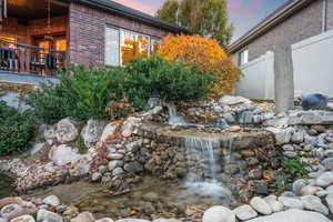 Exterior view of brick siding and a garden pond