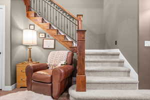 Staircase featuring baseboards