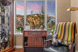 Sitting room with wood finished floors and baseboards