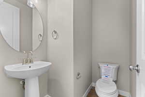 Bathroom with baseboards and wood finished floors