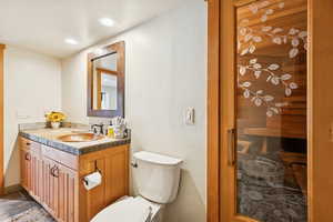 Half bath featuring vanity, a relaxing sauna, and recessed lighting