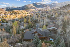 Aerial overview of property's location featuring a mountain backdrop