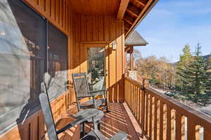 Balcony featuring a sunroom
