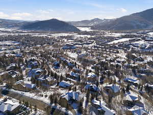 Snowy aerial view featuring a mountain view
