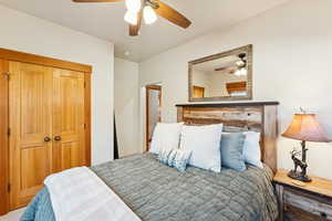 Bedroom with a closet and ceiling fan