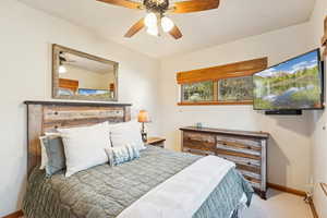 Bedroom with carpet and a ceiling fan