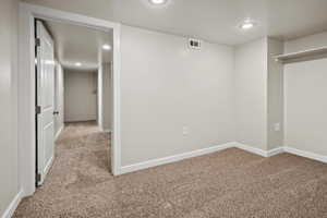 Below grade area featuring carpet flooring and recessed lighting