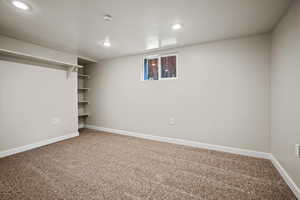 Basement with carpet floors and recessed lighting