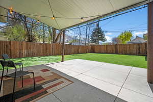 Fenced backyard featuring a patio