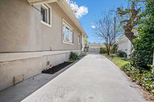 View of property exterior with crawl space and stucco siding