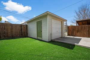 View of outbuilding with driveway
