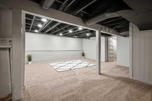 Finished below grade area featuring carpet