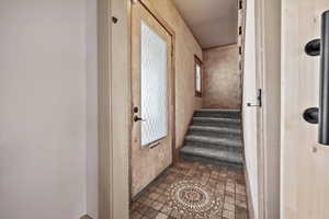 Staircase with tile patterned floors