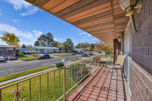 Covered porch with a residential view