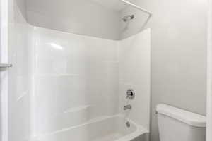 Full bathroom with shower / bathtub combination and toilet