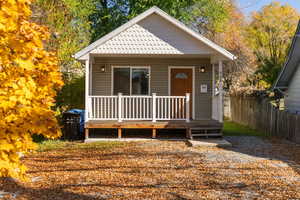 View of front of home with a wooden deck