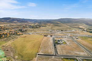 Aerial view of sparsely populated area with a mountain backdrop