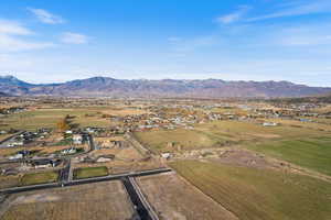 Aerial view of property's location with a mountain backdrop