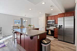 Bright, open kitchen with SS appliances & abundant seating