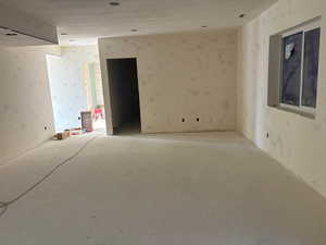 Empty room featuring wallpapered walls