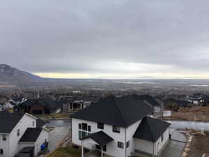 Aerial perspective of suburban area featuring a mountainous background