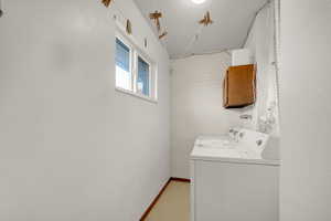 Laundry room with washer and dryer and cabinet space