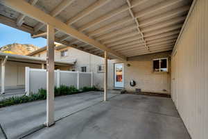View of patio / terrace featuring a mountain view and an attached carport