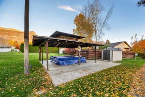 View of patio / terrace featuring a shed and a covered pool
