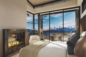 Bedroom featuring a high end fireplace, a water and mountain view, access to outside, multiple windows, and expansive windows