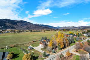 View of street, mountain background featuring rural landscape