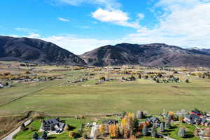 View of mountain background featuring rural landscape